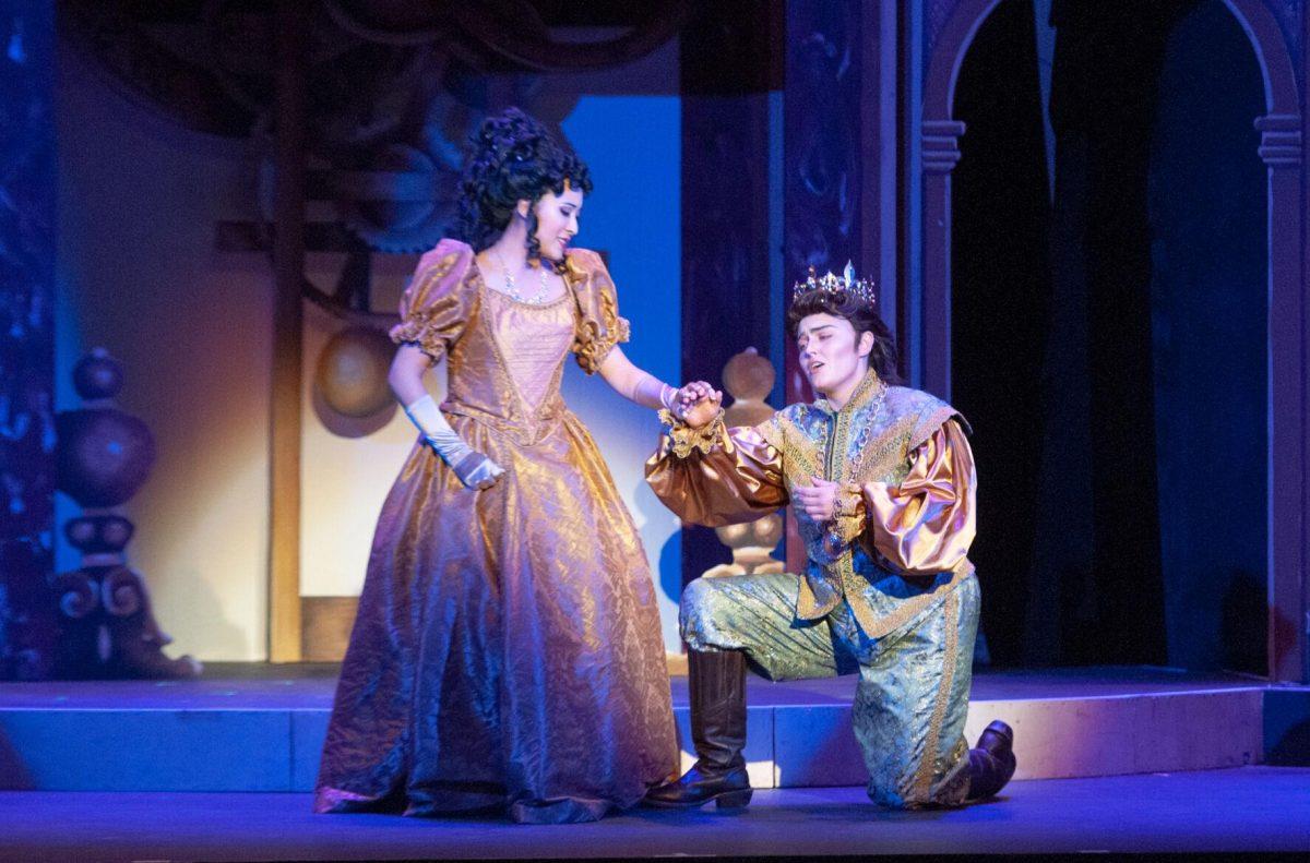 Playing Cendrillon, Chuyan Luo holds Prince Charmant's hand, played by Olivia Newcomb on Friday, Nov. 11, 2022, in the Shaver Theater on Dalrymple Drive in Baton Rouge, La.