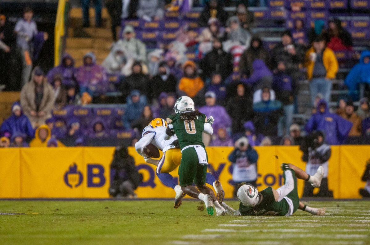 UAB football junior safety Keondre Swoopes (0) lunges for the ball caarried by LSU football player on Saturday, Nov. 19, 2022, during the LSU vs UAB game in Baton Rouge, La.