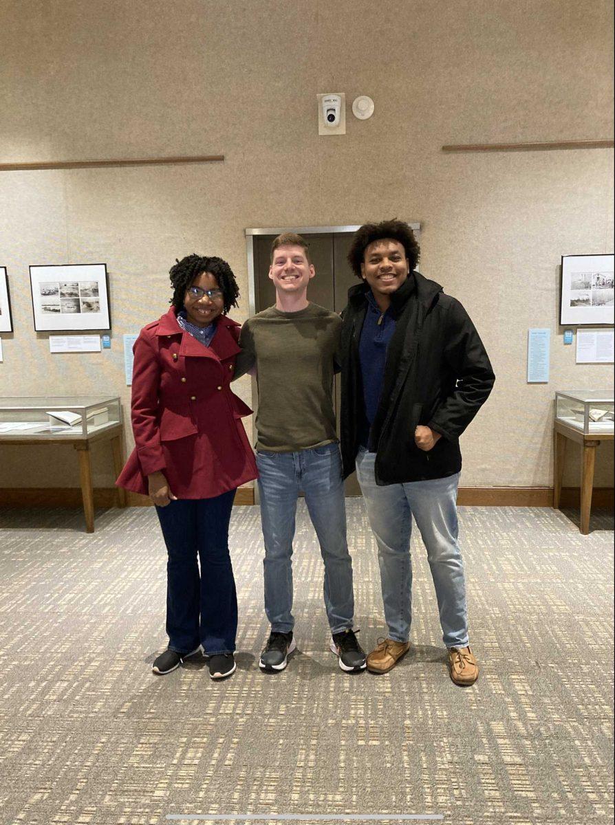 Graduate students smiling after a meeting.&#160;