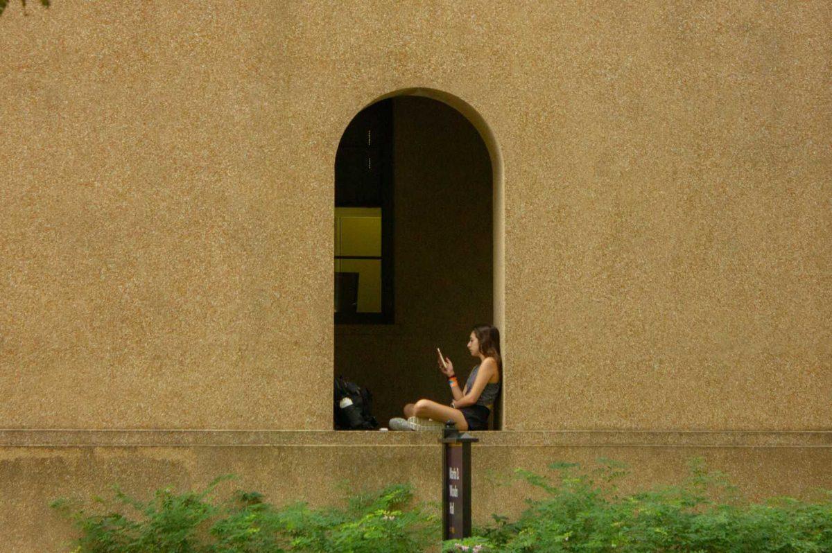 An LSU student sits in the archway on Monday, Nov. 7, 2022, in the Quad in Baton Rouge, La.