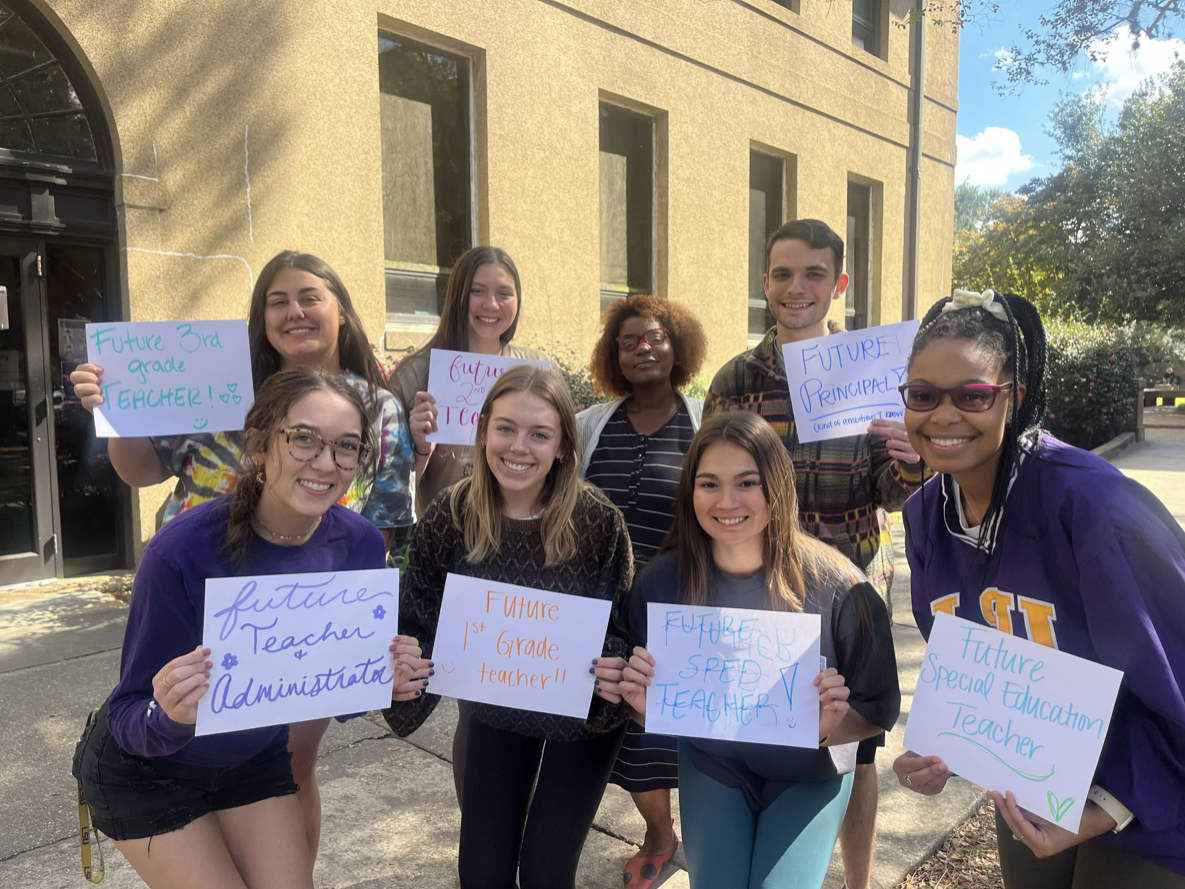 Students in&#160;Consultation, Collaboration and Co-teaching pictured outside of Peabody Hall holding papers that read their future goals.&#160;Back row: (Left to Right) Megan McGinnis, Sydney Rhodes, Professor Valentina Rideaux, Collin CrousillacFront row: (Left to Right) Cate Sherman, Stephanie Fairburn, Aijah Lathan&#160;