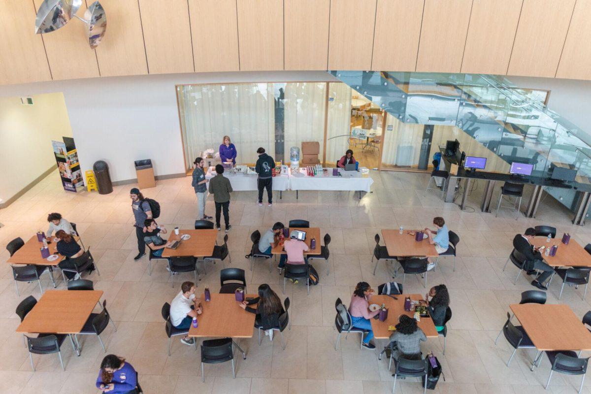 Participants in Startup LSU chat with each other on Friday, Nov. 11, 2022, inside the Business Education Complex on South Quad Drive in Baton Rouge, La.