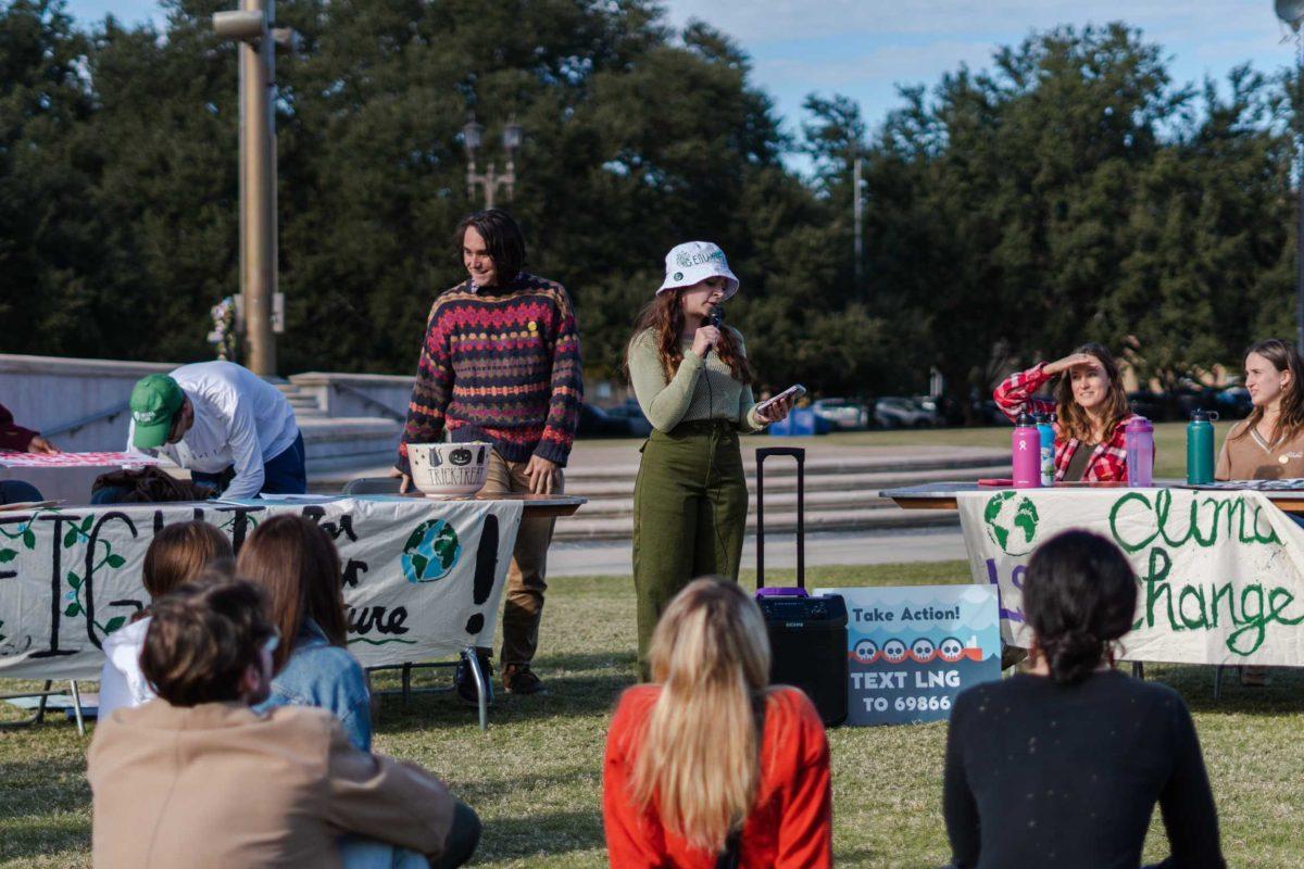 Rally organizer Cheyenne Autin speaks to those gathered on Friday, Nov. 18, 2022, on the LSU Parade Ground before the march begins.