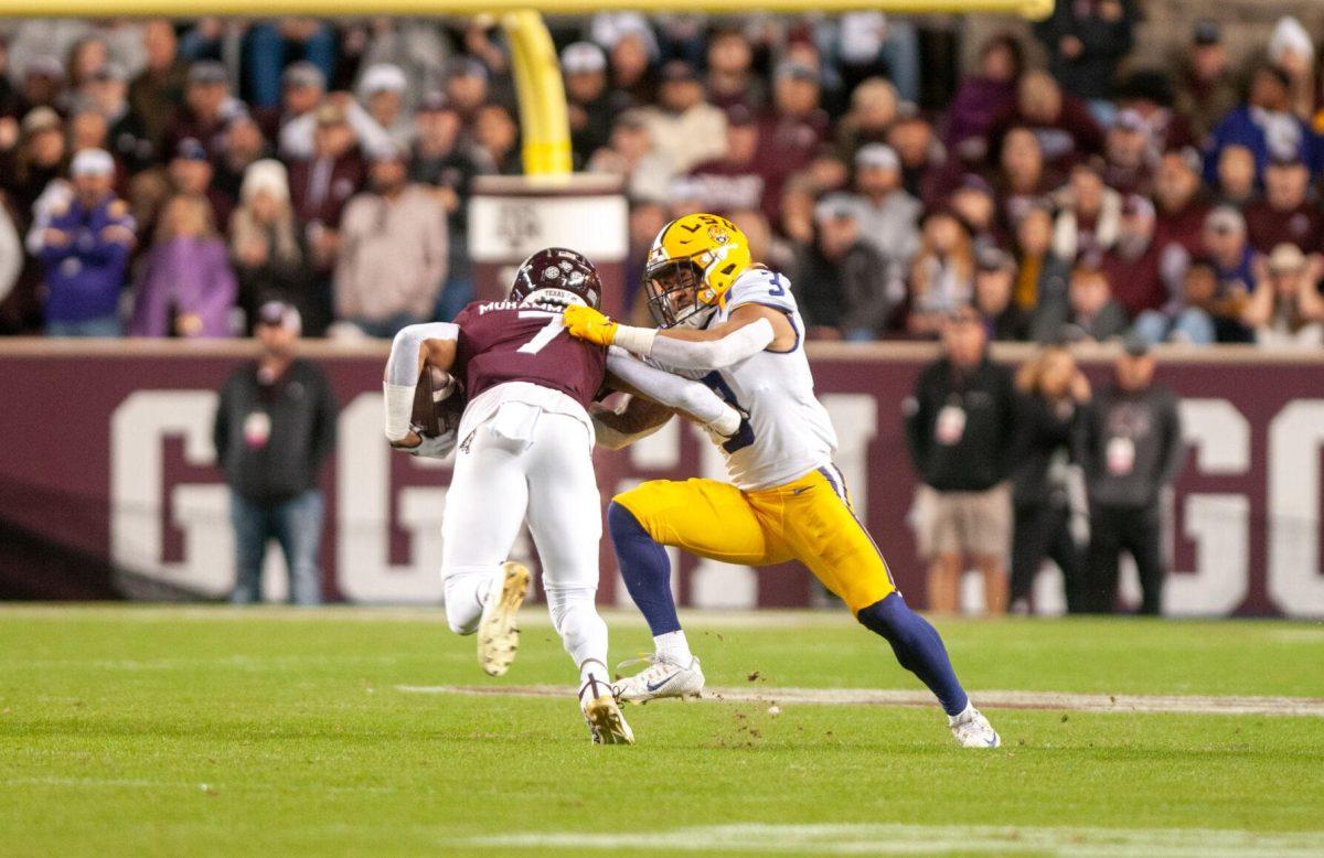 LSU football senior safety Greg Brooks Jr. (3) tackles his opponent on Saturday, Nov. 26, 2022, during LSU's 23-38 loss against Texas A&amp;M at Kyle Field.