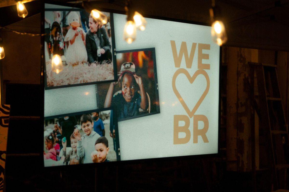 A presentation by Vessel Church includes this slide expressing their love for Baton Rouge on Friday, Nov. 18, 2022, at Mid City Merchant's White Light Night on Government Street in Baton Rouge, La.