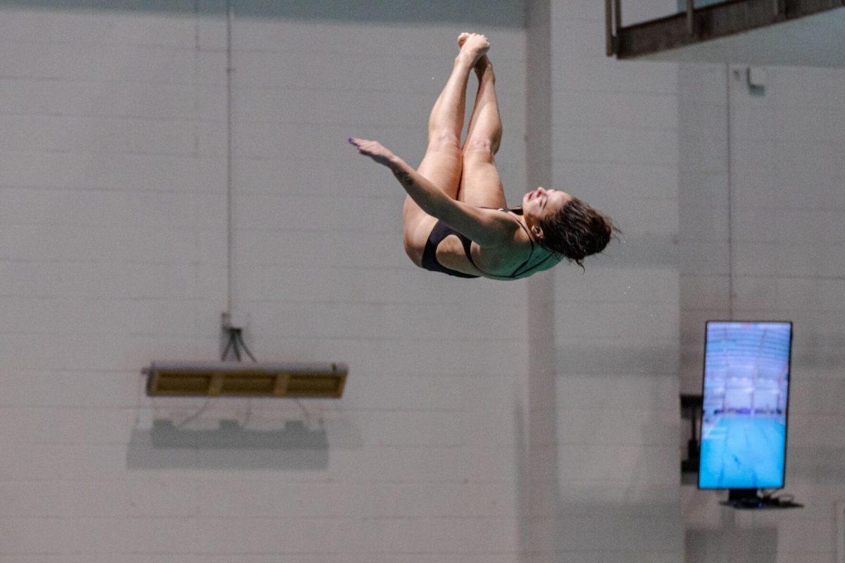 LSU diving junior Montserrat Gutierrez Lavenant twists in the air on Friday, Nov. 4, 2022, during LSU&#8217;s win over Alabama at the LSU natatorium in Baton Rouge, La.