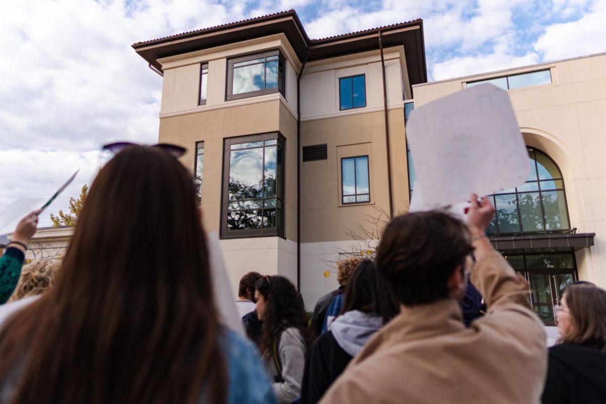 Demonstrators chant on Friday, Nov. 18, 2022, outside of the LSU Foundation building on Nicholson Drive in Baton Rouge, La.