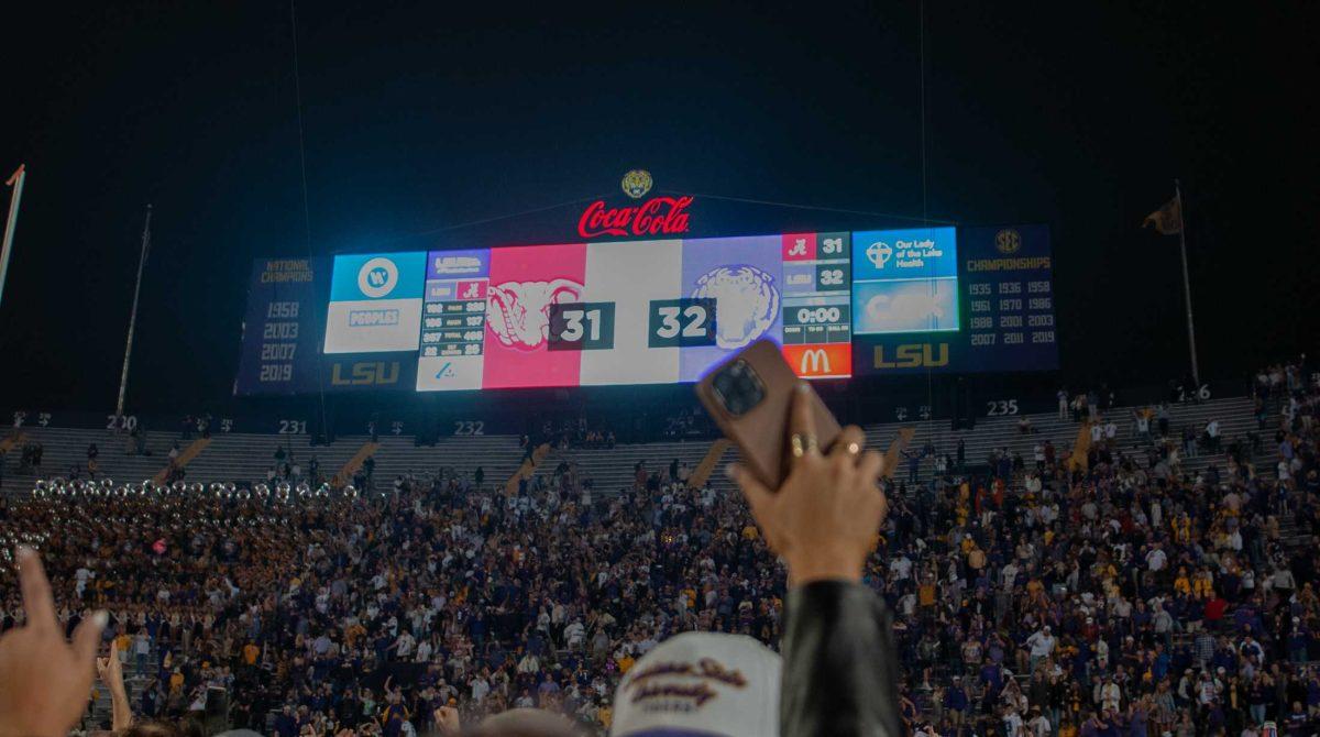 LSU fans storm the field in celebration on Saturday, Nov. 5, 2022, after LSU&#8217;s 32-31 victory over Alabama in Tiger Stadium in Baton Rouge, La.