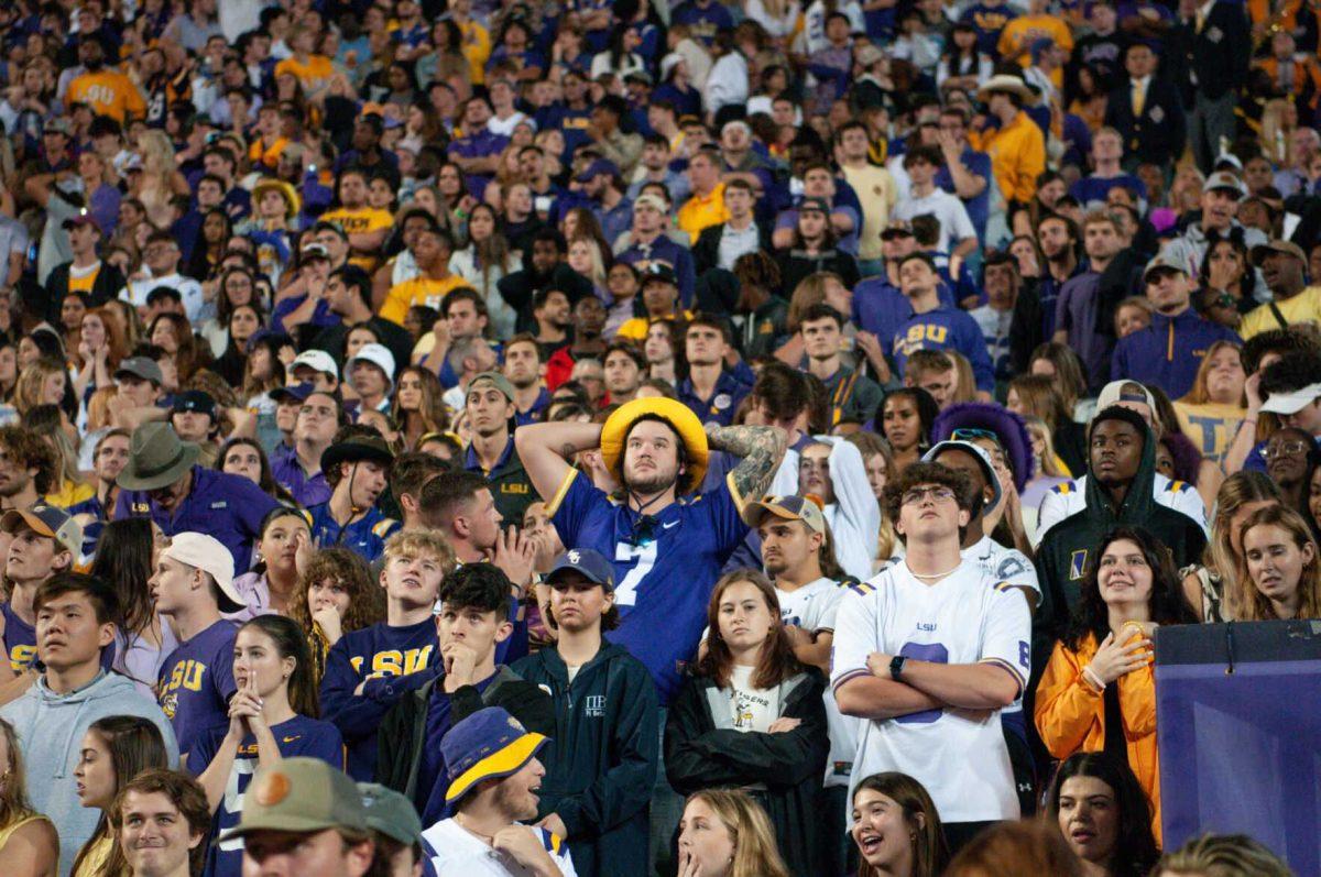 The student section watches quietly for the first time all night while referees review a call during the fourth quarter on Saturday, Nov. 5, 2022, during LSU&#8217;s 32-31 victory over Alabama in Tiger Stadium in Baton Rouge, La.