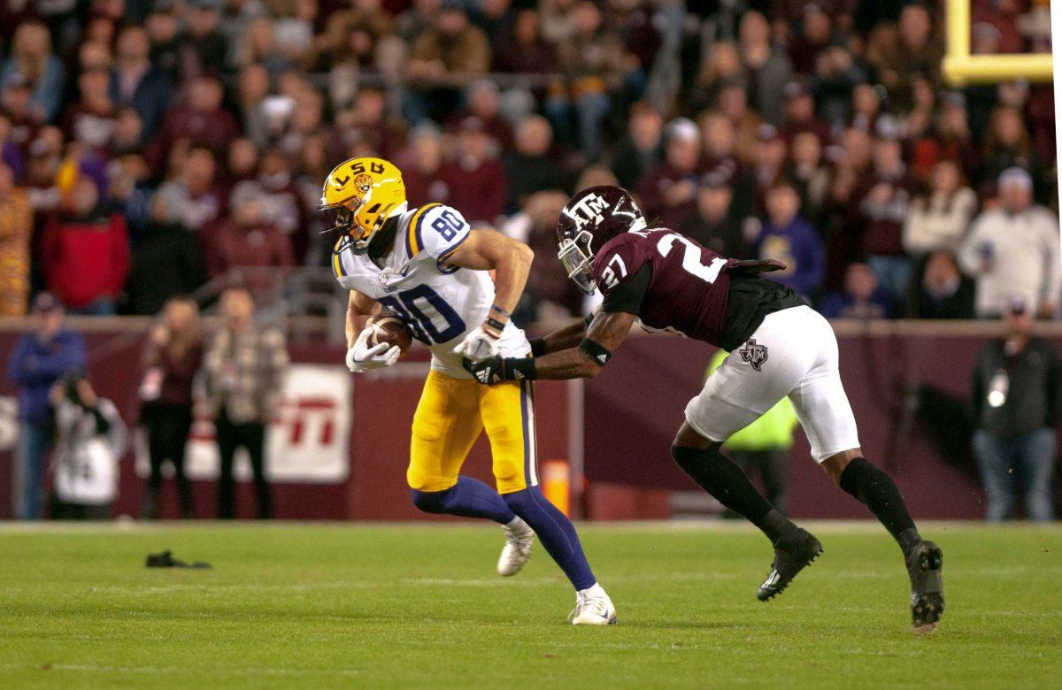 LSU football sophomore wide receiver Jack Bech (80) fights against the defense on Saturday, Nov. 26, 2022, during LSU's 23-38 loss against Texas A&amp;M at Kyle Field.