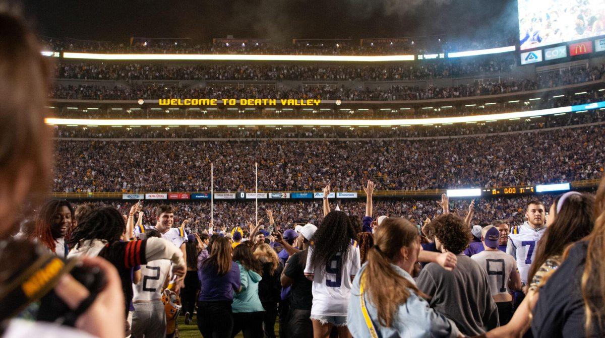 LSU football fans storm the field on Saturday, Nov. 5, 2022, after LSU's 32-31 victory in Tiger Stadium in Baton Rouge, La.