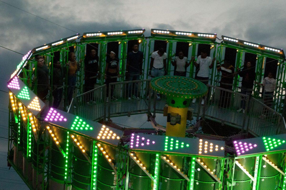 Spinning passengers scream on a ride at the Greater Baton Rouge State Fair on Sunday, Oct. 30, 2022, at the Lamar Dixon Expo Center in Gonzales, La.