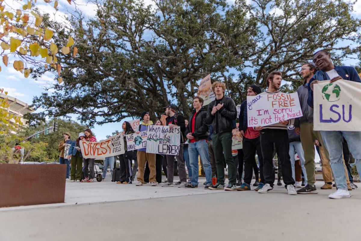 Demonstrators chant on Friday, Nov, 18, 2022, outside of the LSU Foundation building on Nicholson Drive in Baton Rouge, La.