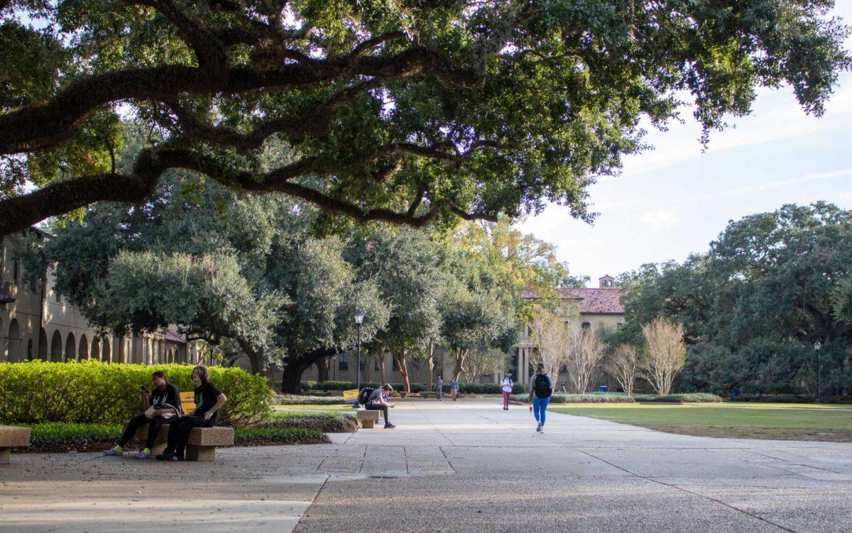 Students walk and sit throughout the Quad on Wednesday, Nov. 9, 2022, in the Quad on LSU Campus.