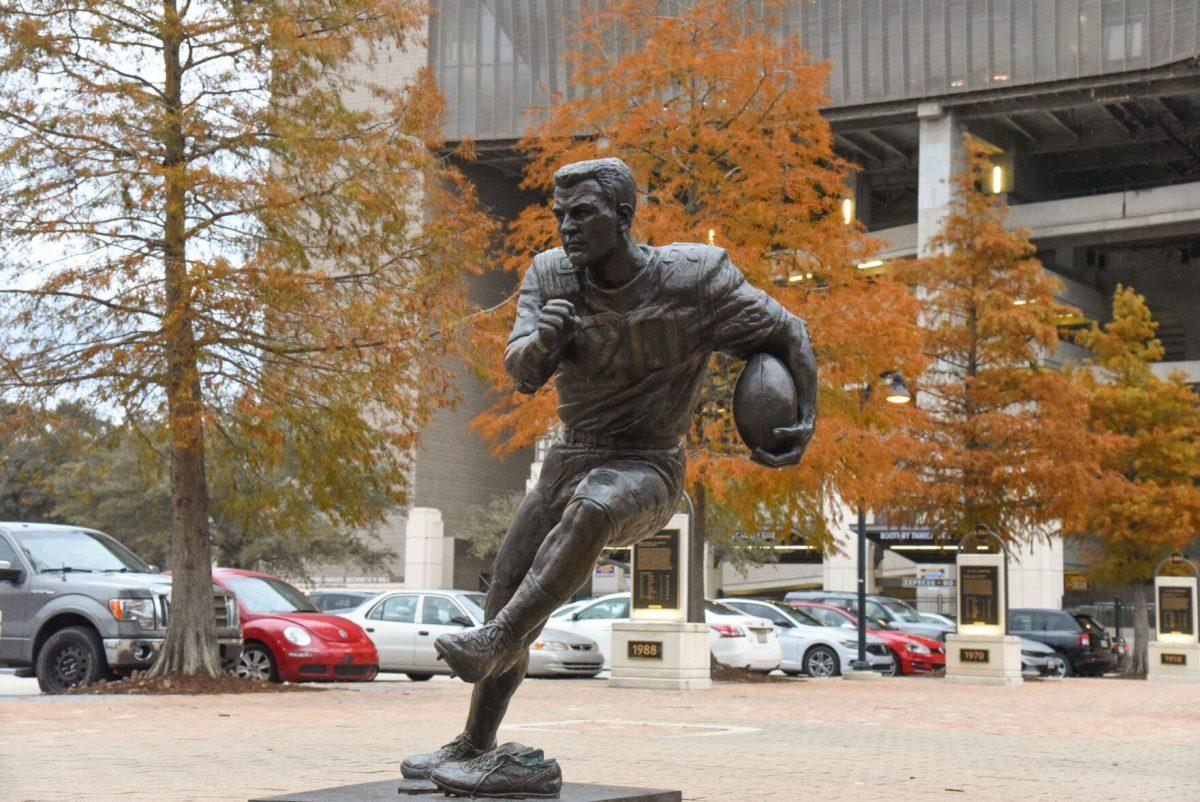 A statue sits among trees on Tuesday, Nov. 22, 2022, in front of Tiger Stadium in Baton Rouge, La.