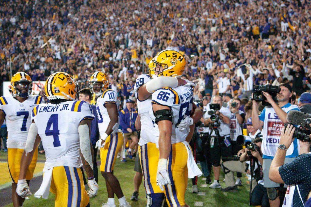 Offensive line Charles Turner III embraces tight end Mason Taylor after an exhilarating touchdown on Saturday, Nov. 5, 2022, during LSU&#8217;s 32-31 victory over Alabama in Tiger Stadium in Baton Rouge, La.