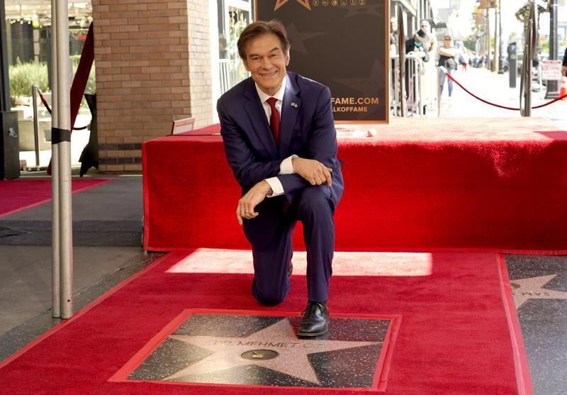 FILE - Mehmet Oz, the former host of "The Dr. Oz Show," poses atop his new star on the Hollywood Walk of Fame during a ceremony on Feb. 11, 2022, in Los Angeles.&#160;