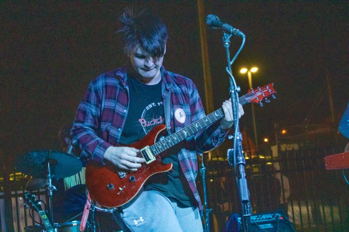 Guitarist Kade Simar of WaveRunner performs with a Theta loves CASA sticker on Friday, Nov. 18, 2022, at Red Stick Social on Government Street in Baton Rouge, La.