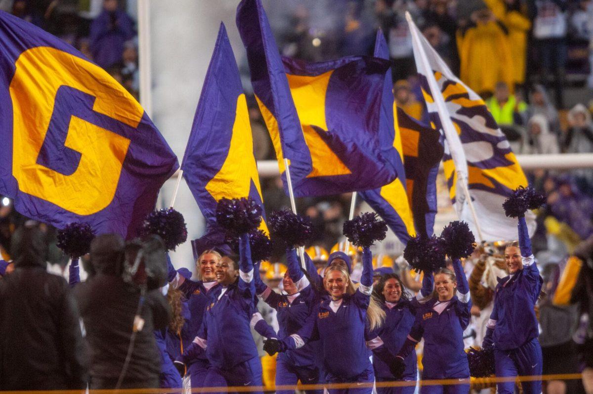 The LSU Tiger Girls run out onto the field on Saturday, Nov. 19, 2022, during pregame inside Tiger Stadium in Baton Rouge, La.