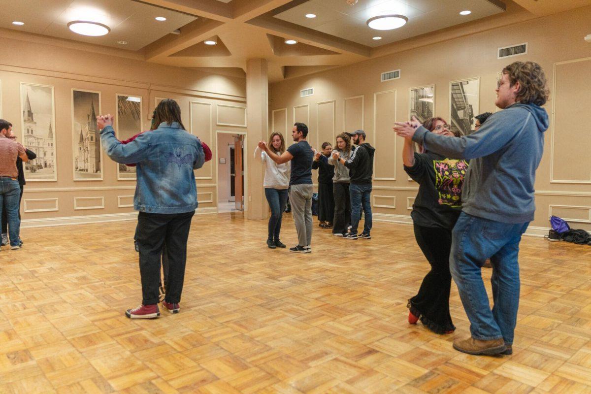 Members of the LSU ballroom dance club pair up to practice their new moves on Tuesday, Nov. 15, 2022, inside the LSU Student Union in Baton Rouge, La.