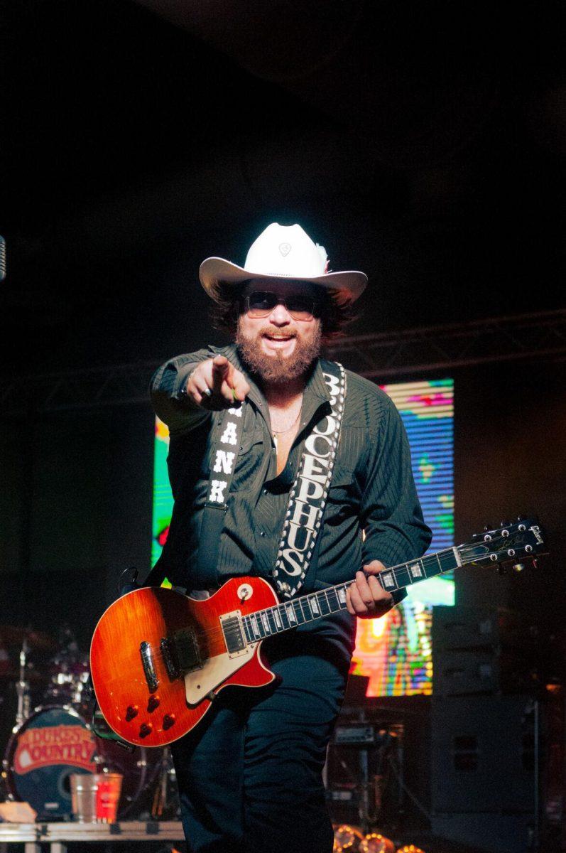 The guitarist for The Dukes of Country points to the camera at the Greater Baton Rouge State Fair on Sunday, Oct. 30, 2022, at the Lamar Dixon Expo Center in Gonzales, La.