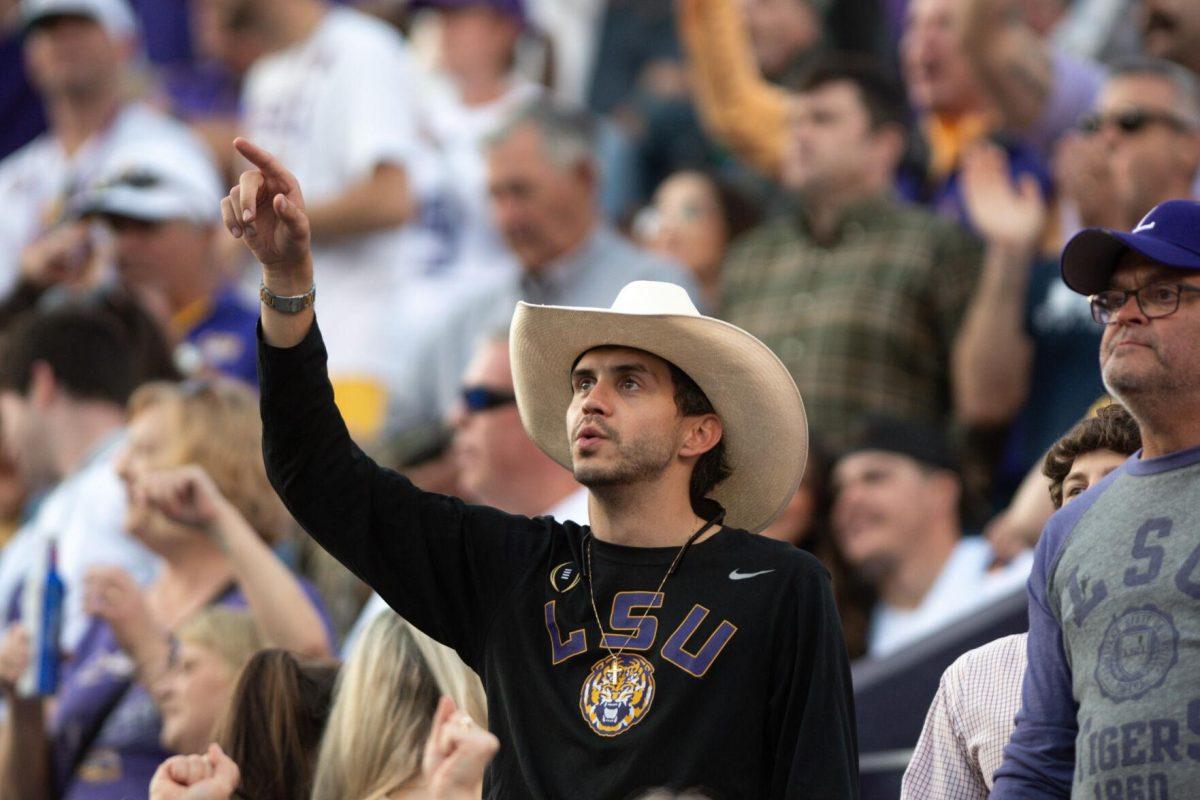 A fan points upwards while singing "Calling Baton Rouge" on Saturday, Nov. 5, 2022, during LSU&#8217;s 32-31 victory over Alabama in Tiger Stadium in Baton Rouge, La.