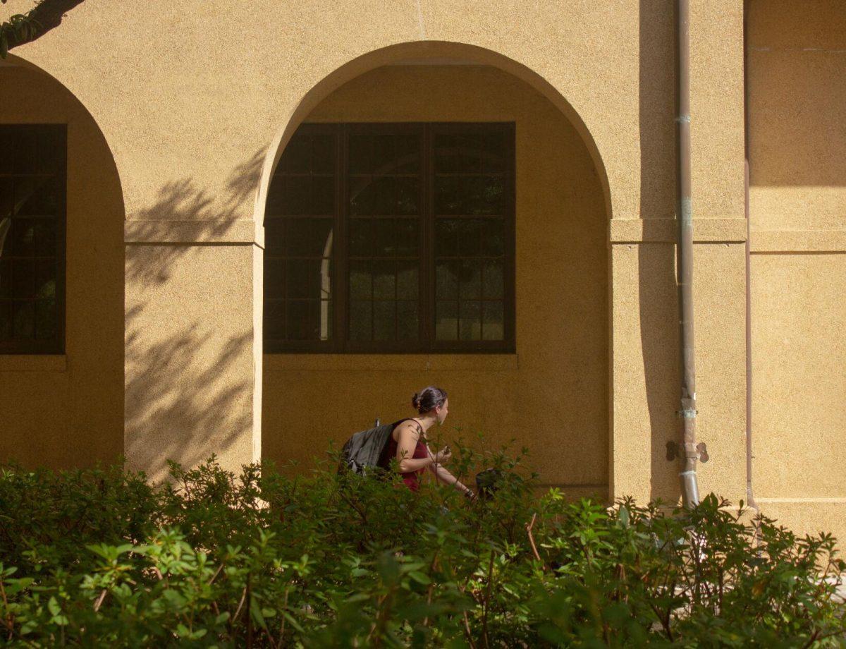 The LSU student rides her bike on Monday, Nov. 7, 2022, in the Quad in Baton Rouge, La.