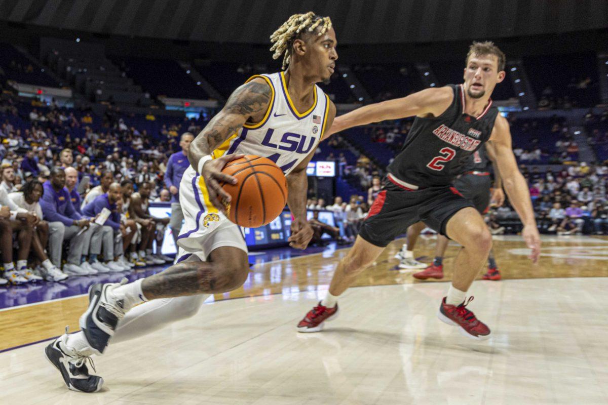 LSU basketball sophomore guard Adam Miller (44) breaks through the Arkansas defense Saturday, Nov. 12, 2022, during LSU's 61-52 victory over Arkansas State at the Pete Maravich Assembly Center on N. Stadium Drive.