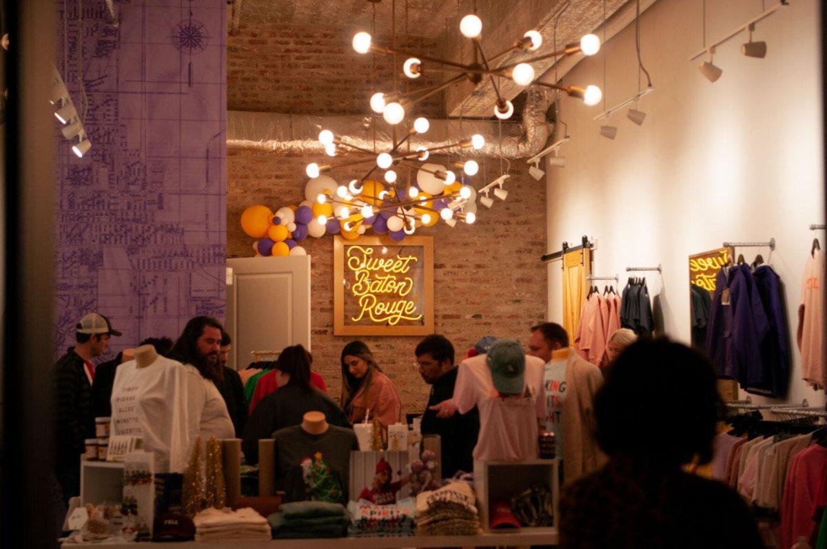 Guests browse merchandise inside Sweet Baton Rouge on Friday, Nov. 18, 2022, at Mid City Merchant's White Light Night on Government Street in Baton Rouge, La.