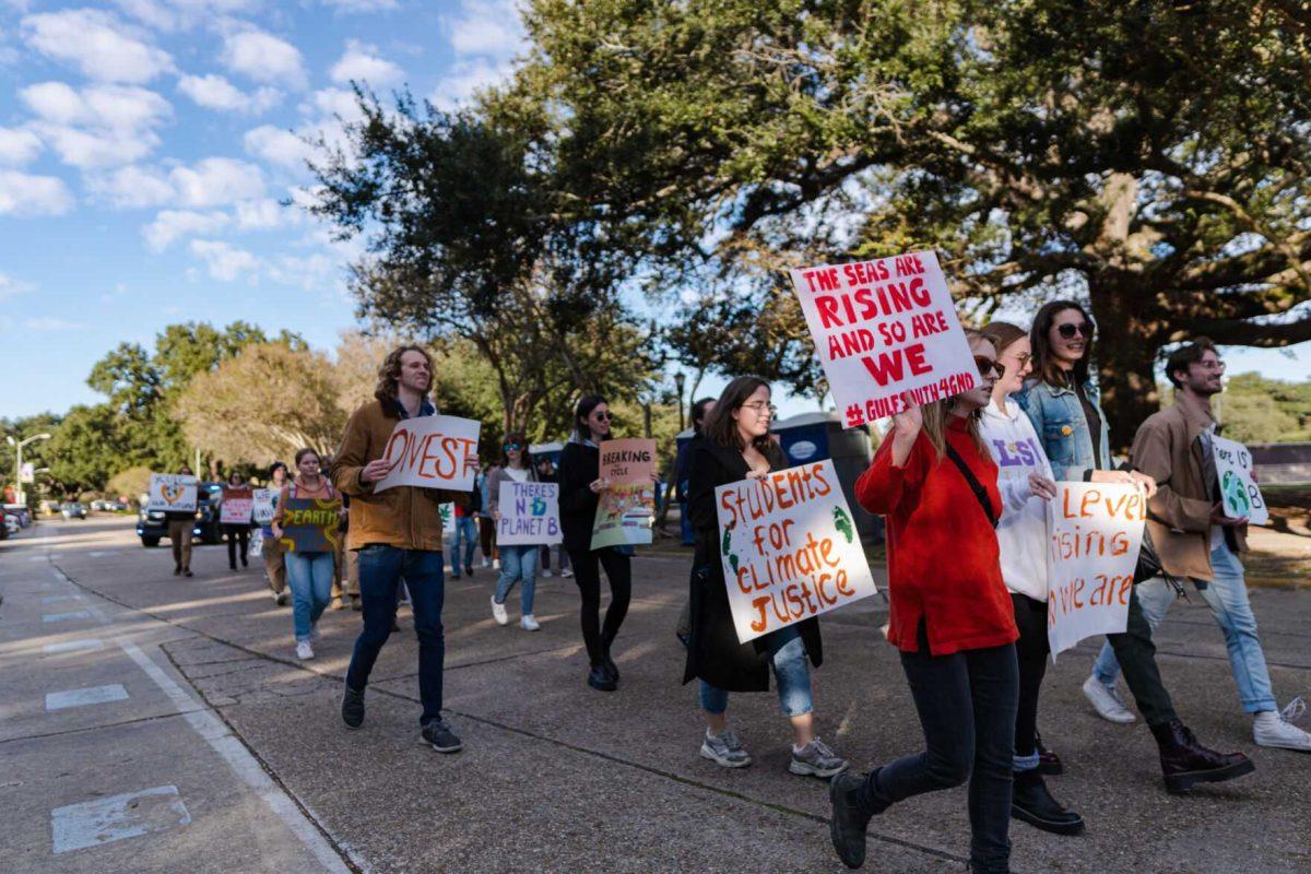 Rally-goers begin their march on Friday, Nov. 18, 2022, down Tower Drive in Baton Rouge, La.