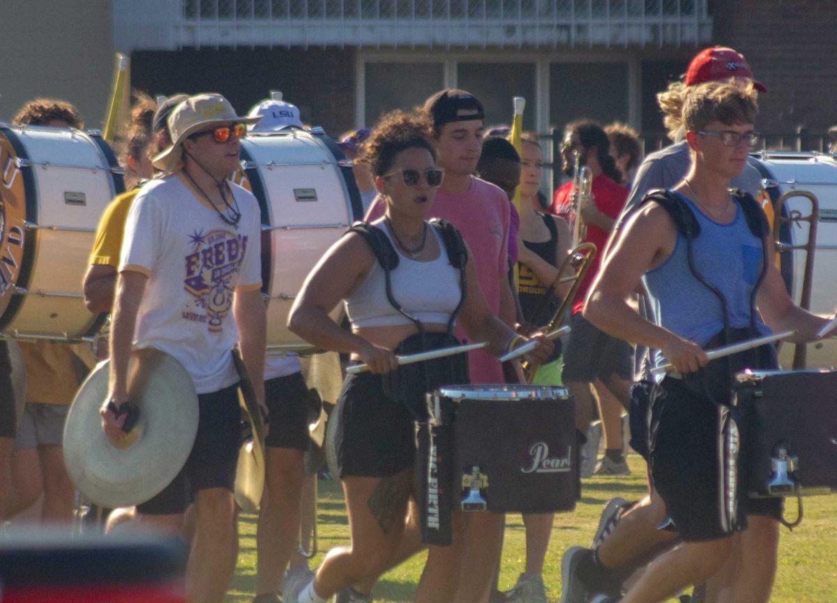 The LSU Tiger Marching Band percussion players run down the field on Thursday, Oct. 6, 2022, at the LSU Band Hall on Aster Street in Baton Rouge, La.