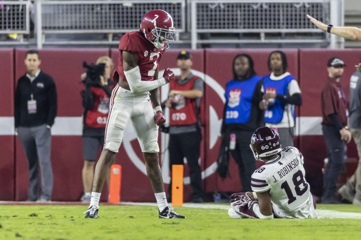 Alabama defensive back Eli Ricks (7) reacts after defending against Mississippi State wide receiver Justin Robinson (18) on an incomplete pass during the second half of an NCAA college football game Saturday, Oct. 22, 2022, in Tuscaloosa, Ala. (AP Photo/Vasha Hunt)