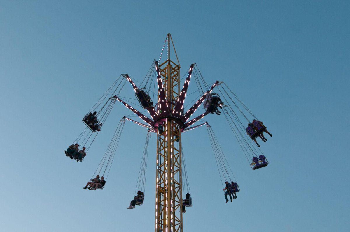 Thrill-seekers rotate and elevate on a ride at the Greater Baton Rouge State Fair on Sunday, Oct. 30, 2022, at the Lamar Dixon Expo Center in Gonzales, La.