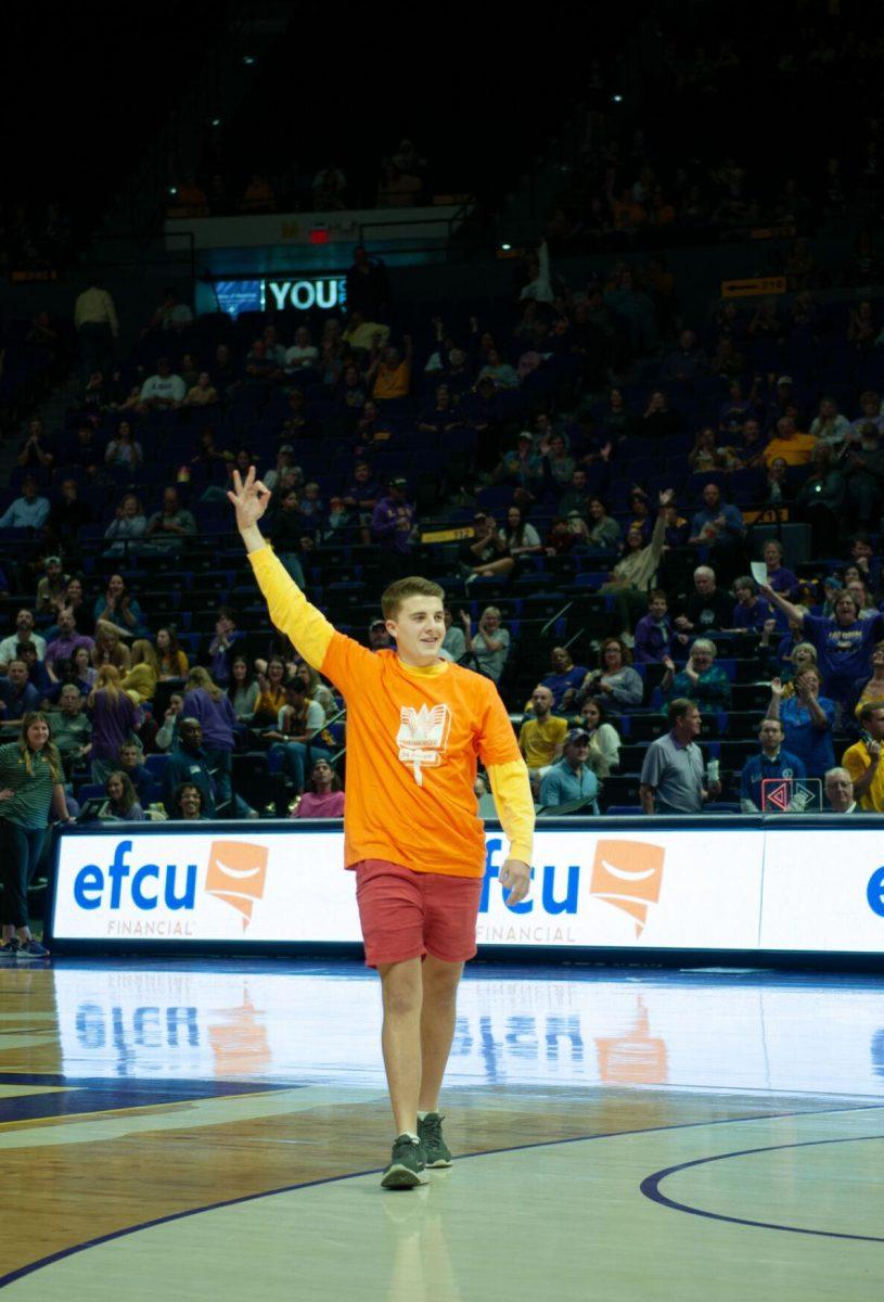 A fan holds up three fingers after winning the Whataburger competition during half time at the LSU 111-41 victory over Mississippi Valley State on Friday, Nov. 11, 2022, at the Pete Maravich Assembly Center on N. Stadium Drive.