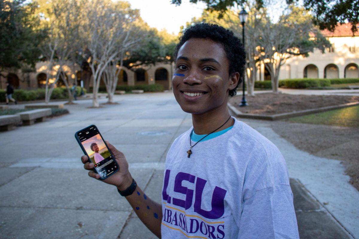 Sophomore student Jahbari Parquet shows off his post on the BLACKLSU26 instagram page on Sunday, Nov. 20, 2022, in the quad on LSU's campus.