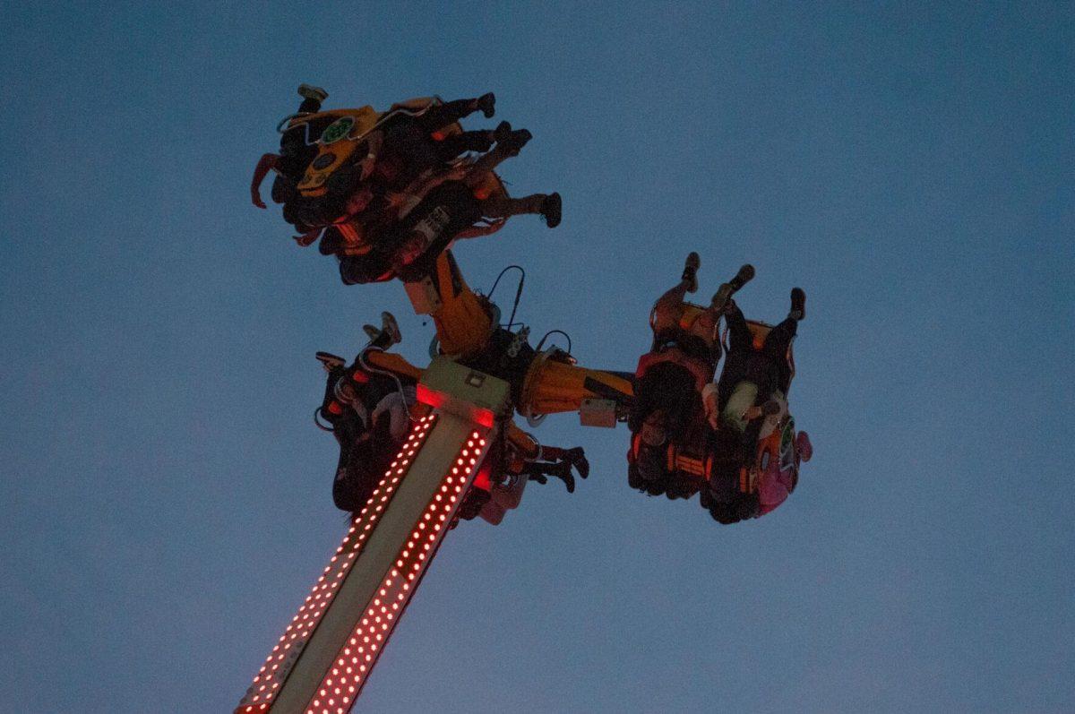 Three groups of people catapult into the air on a ride at the Greater Baton Rouge State Fair on Sunday, Oct. 30, 2022, at the Lamar Dixon Expo Center in Gonzales, La.