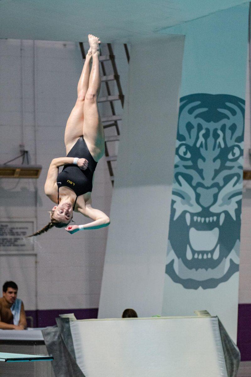 LSU diving sophomore Maggie Buckley twists through the air on Friday, Nov. 4, 2022, during LSU&#8217;s win over Alabama at the LSU natatorium in Baton Rouge, La.