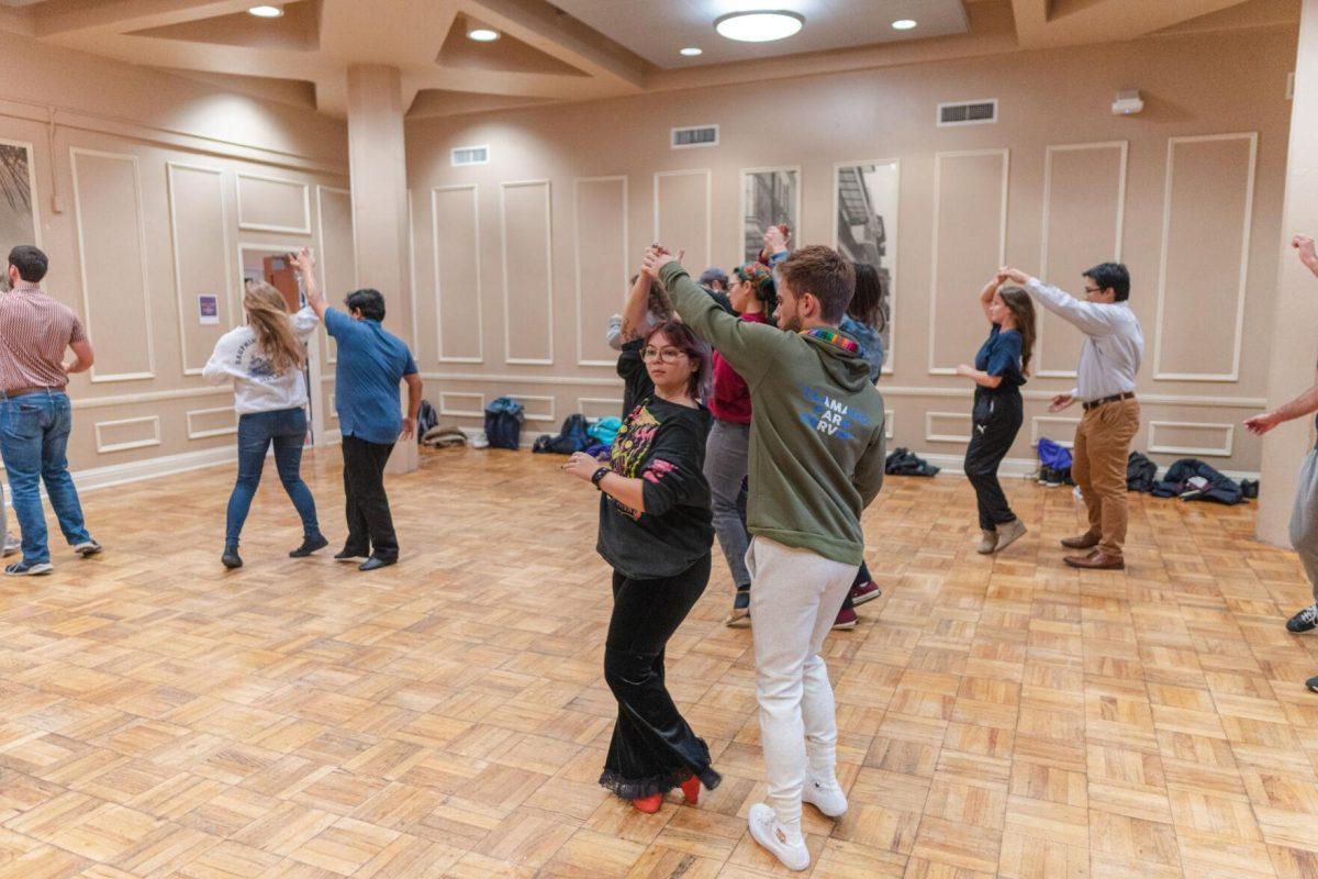 Dancers try a spin on Tuesday, Nov. 15, 2022, inside the LSU Student Union in Baton Rouge, La.