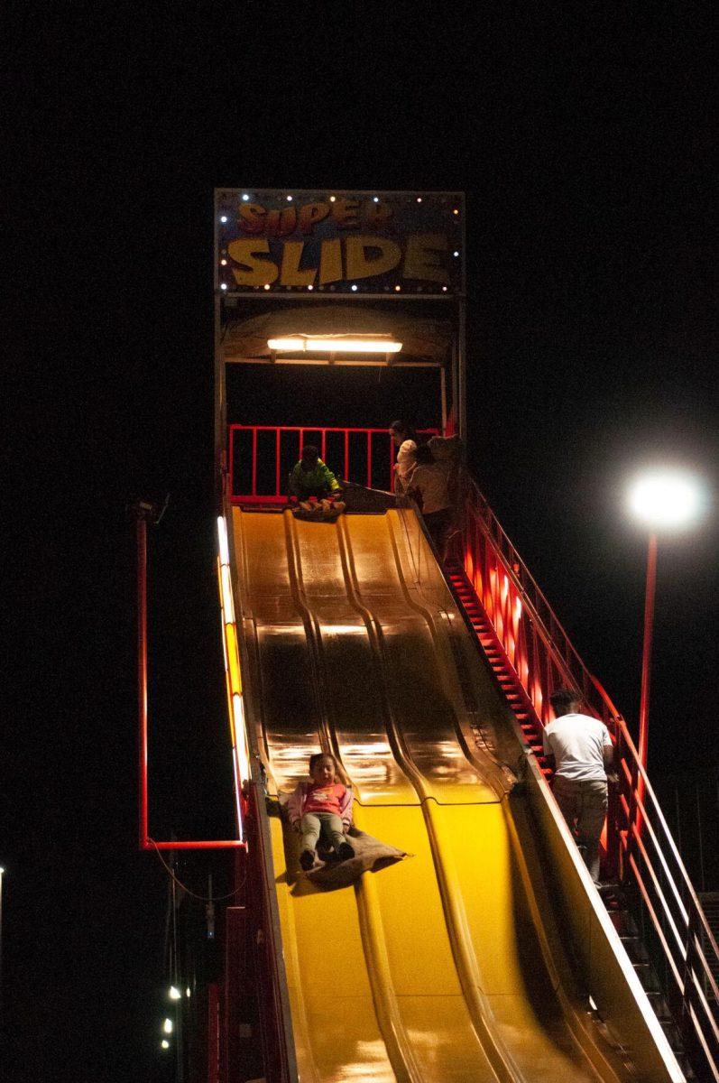 Children take turns on the "Super Slide" at the Greater Baton Rouge State Fair on Sunday, Oct. 30, 2022, at the Lamar Dixon Expo Center in Gonzales, La.