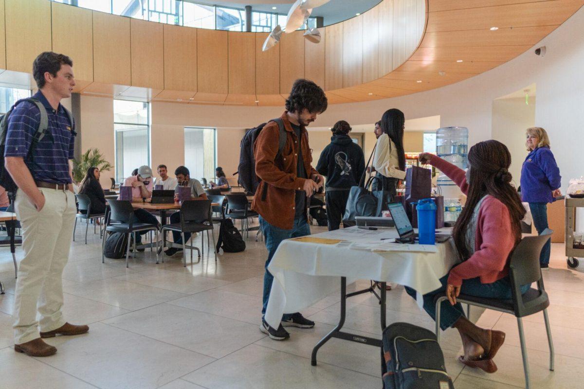 Participants sign in on Friday, Nov. 11, 2022, for Startup LSU inside the Business Education Complex on South Quad Drive in Baton Rouge, La.