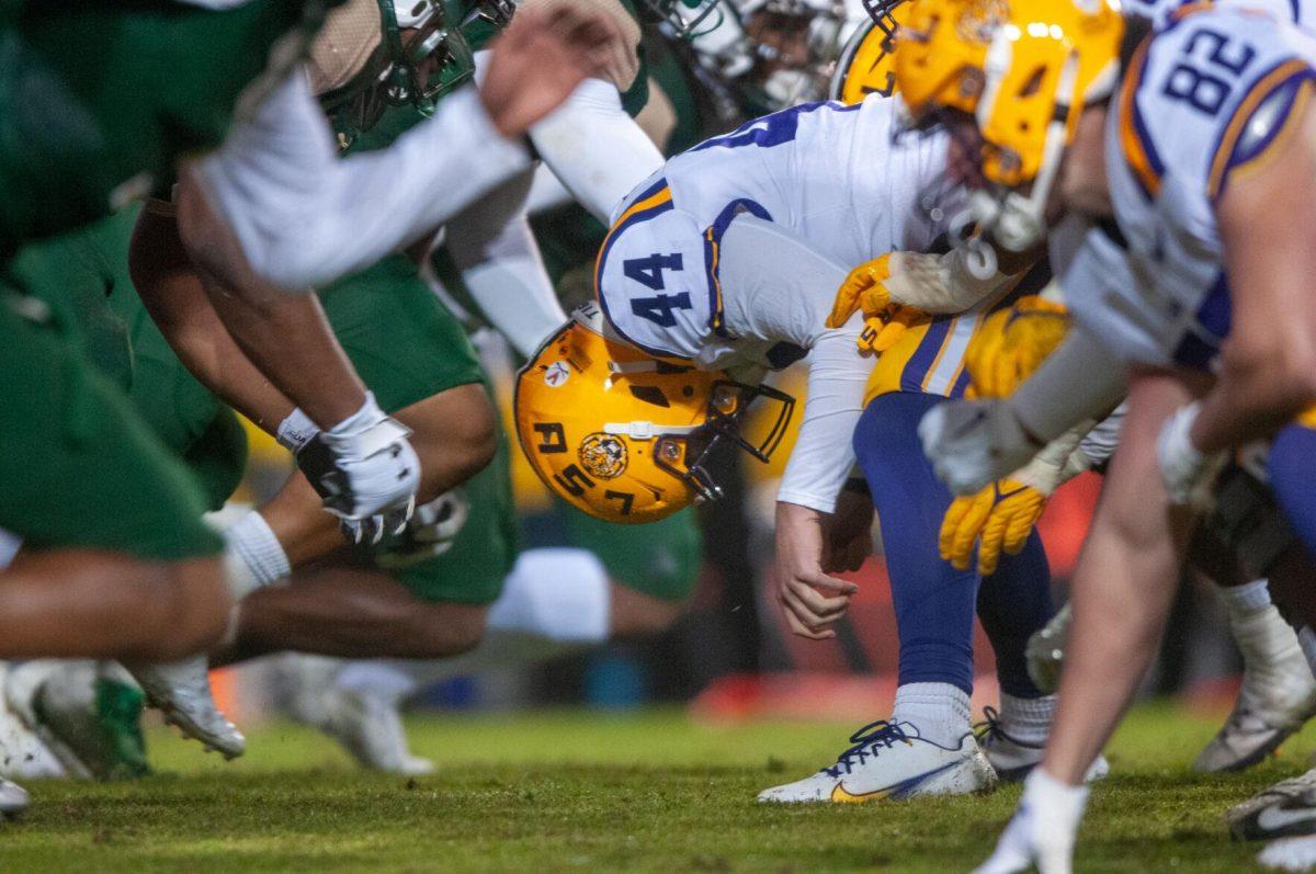 LSU football sophomore snapper Slade Roy (44) leans over just after hiking the ball to the quarterback on Saturday, Nov. 19, 2022, during the LSU vs. UAB game in Baton Rouge, La.