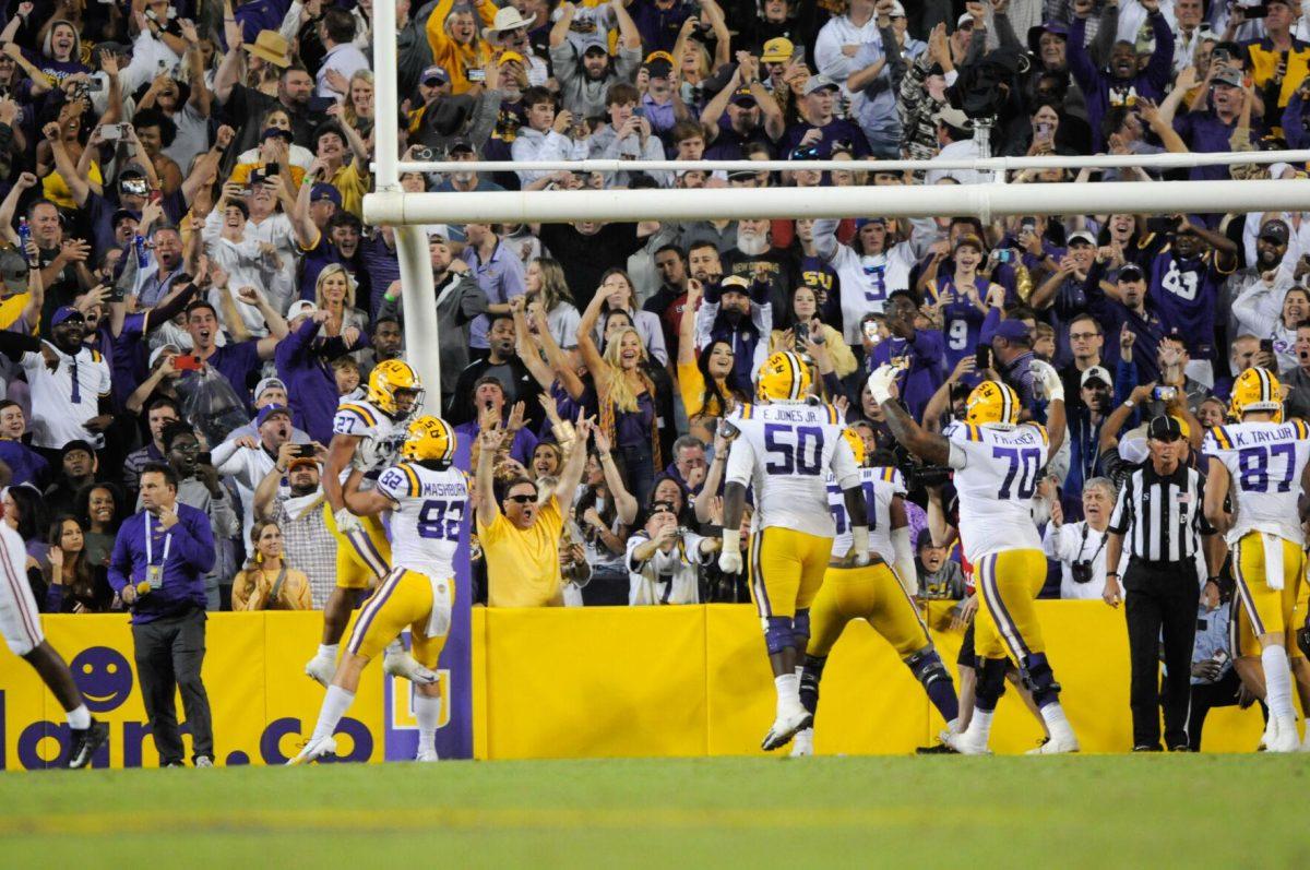 Tight end Jack Mashburn lifts running back Josh Williams to celebrate a touchdown on Saturday, Nov. 5, 2022, during LSU&#8217;s 32-31 victory over Alabama in Tiger Stadium in Baton Rouge, La.