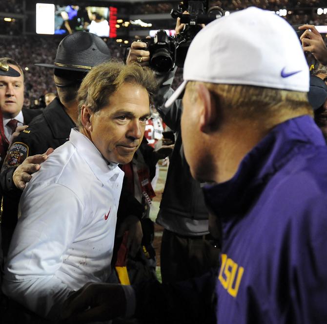 Alabama head coach Nick Saban (left) shakes hand with LSU head coach Les Miles (right) on Saturday, Nov. 9, 2013 after the Tiger's 38-17 loss to the Alabama Crimson Tide at Bryant-Denny Stadium in Tuscaloosa, AL.