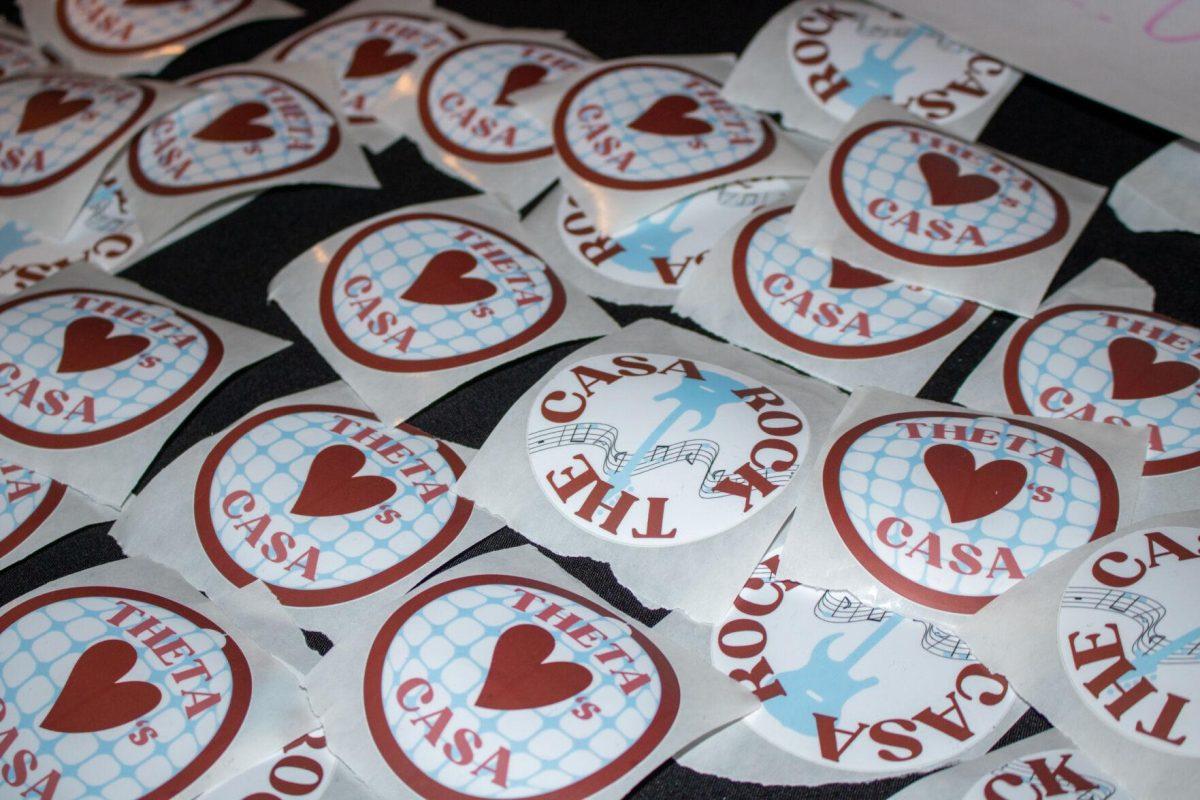 Stickers sold at the event fill the table at Rock the CASA on Friday, Nov. 18, 2022, at Red Stick Social on Government Street in Baton Rouge, La.