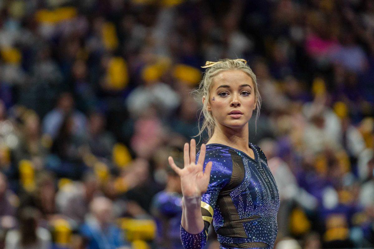 <p>LSU gymnastics all-around sophomore Olivia Dunne warms up for the floor exercise on Friday, March 4, 2022, during LSU gymnastics’ 107.500-197.450 loss against Kentucky in the Pete Maravich Assembly Center on North Stadium Drive in Baton Rouge, La.</p>