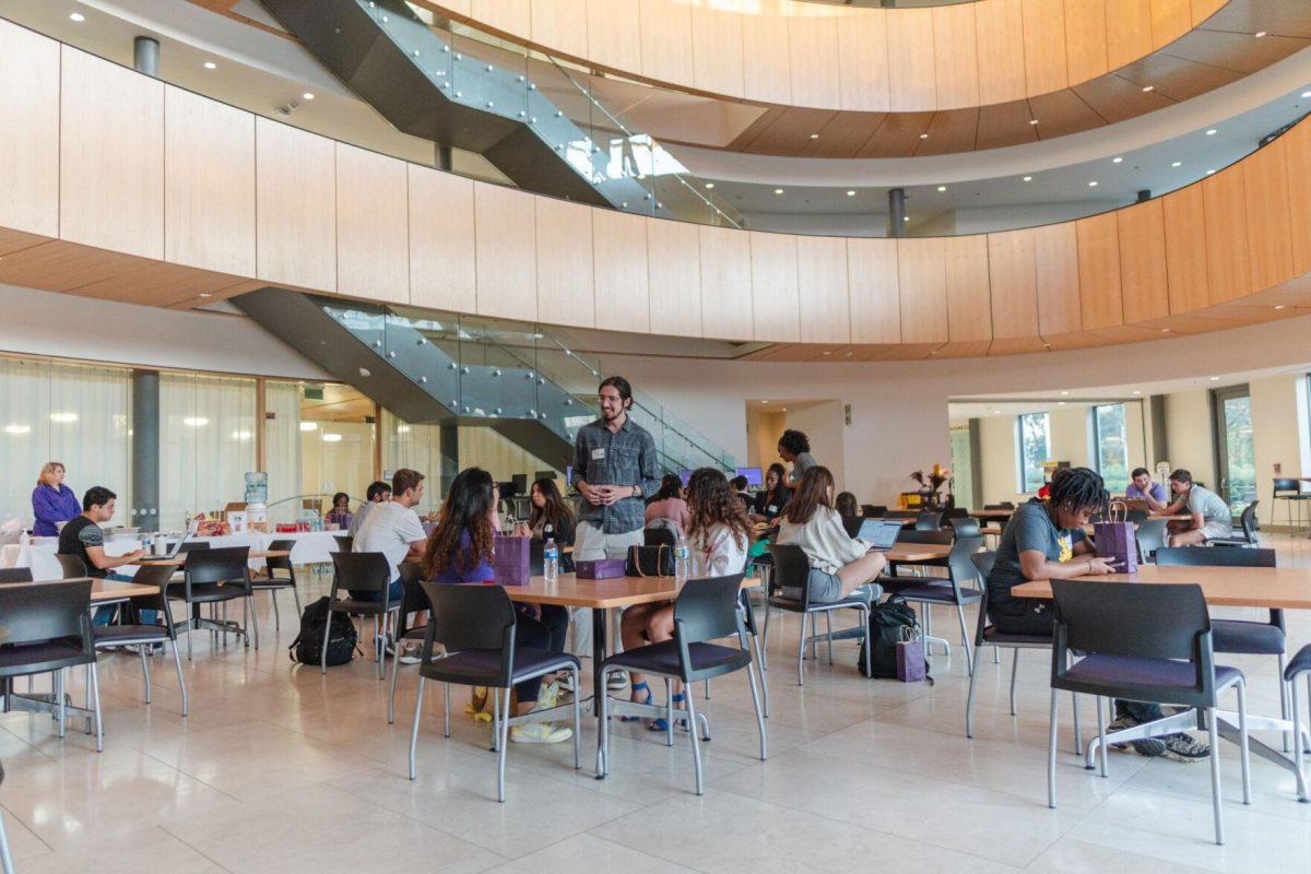 Participants in Startup LSU chat with each other on Friday, Nov. 11, 2022, inside the Business Education Complex on South Quad Drive in Baton Rouge, La.