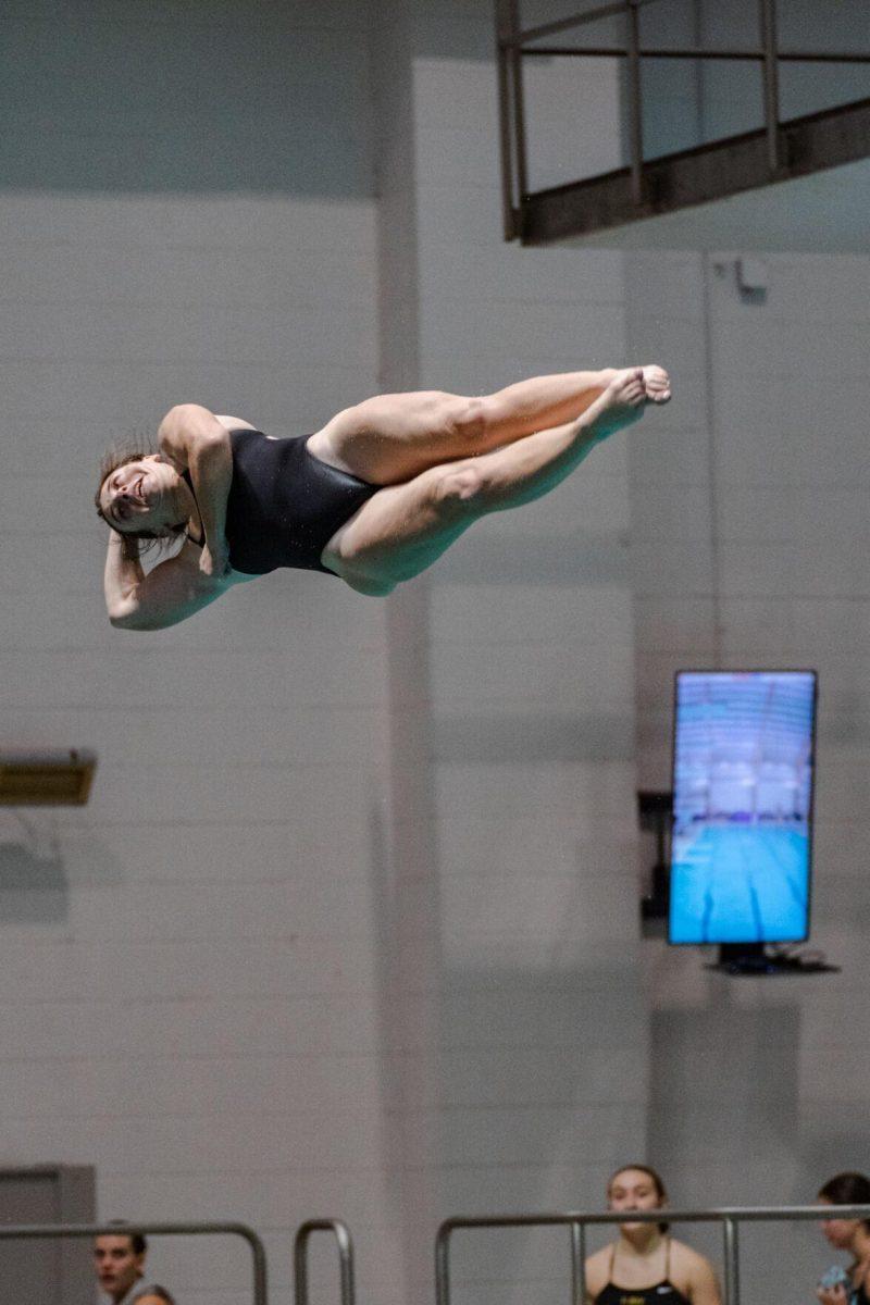 An LSU diver twirls through the air on Friday, Nov. 4, 2022, during LSU&#8217;s win over Alabama at the LSU natatorium in Baton Rouge, La.