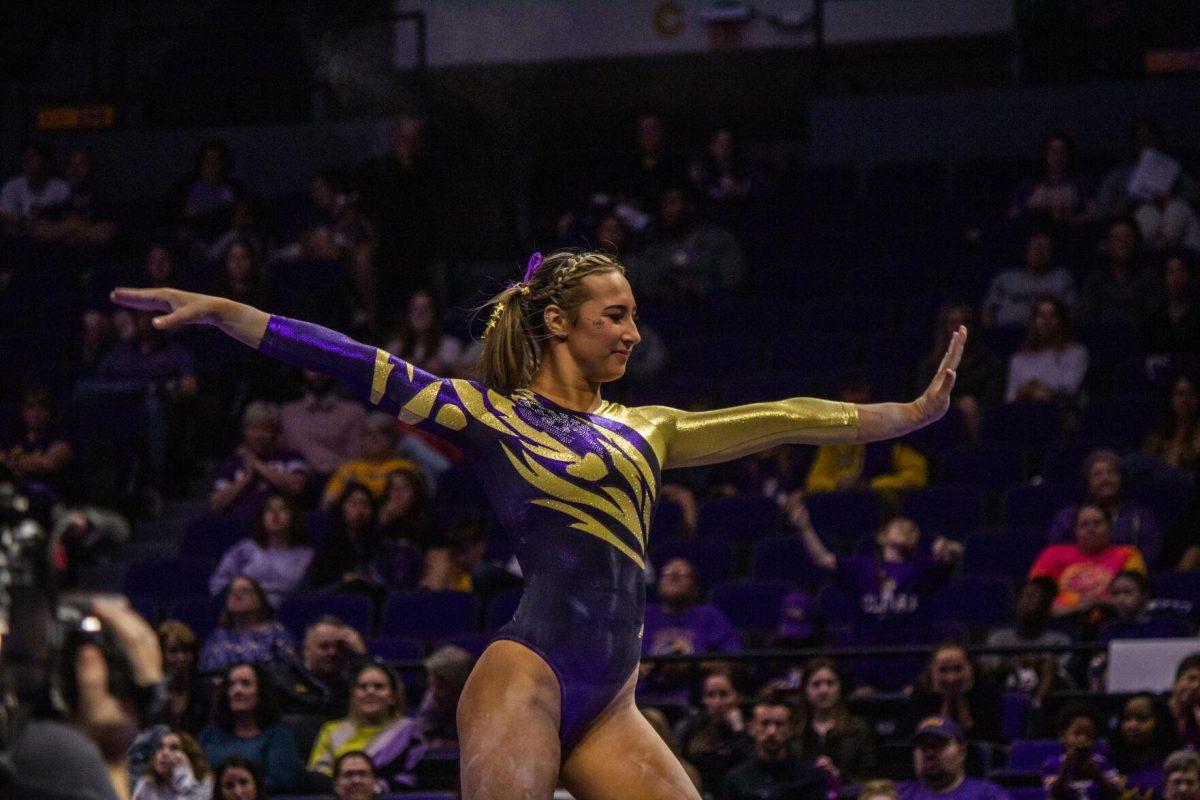 LSU gymnastics senior all-around Alyona Shchennikova poses during her balance beam routine Monday, Dec. 12, 2022, during the annual "Gym 101" showcase in the Pete Maravich Assembly Center.