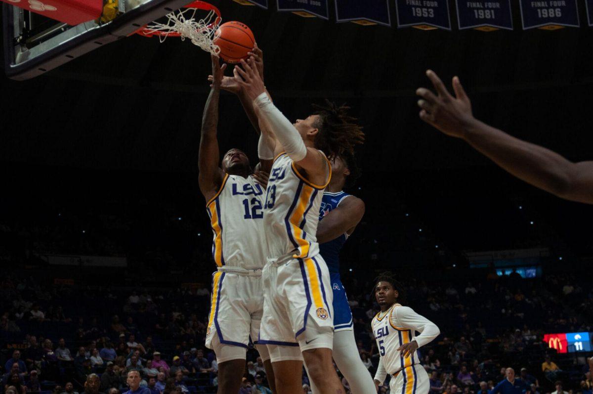 LSU men&#8217;s basketball KJ Williams (12) and Jalen Reed (13) reach for the rebound during LSU&#8217;s 63-59 win against UT Arlington on Friday, Dec. 2, 2022, in the Pete Maravich Assembly Center on N. Stadium Drive in Baton Rouge, La.