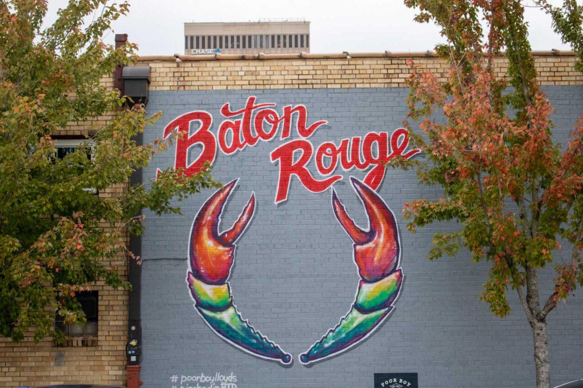 A mural sits between two trees on Friday, Dec 2, 2022, on Lafayette St in downtown Baton Rouge, La.